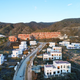 An aerial view of a partially built housing development.